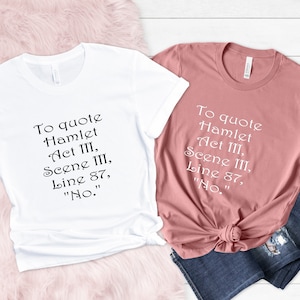 May include: Two t-shirts, one white and one dusty rose, each with the quote "To quote Hamlet Act III, Scene III, Line 87, 'No.'" printed in black. The shirts are displayed with a pair of blue jeans.