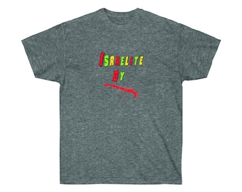 May include: A dark heather grey t-shirt with the words "ISRAELITE BY" printed in colorful letters. The letters are in a red, yellow, green, and blue color scheme. There is a red slash with a red splatter effect below the text.