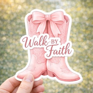May include: A pink sticker featuring a pair of cowboy boots with a large bow at the top. The boots have a textured design and the words "Walk by Faith" are written across the front in a script font.