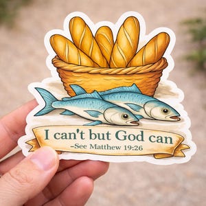 May include: A sticker featuring a basket of golden bread loaves above two blue fish. The sticker has the text "I can't but God can - See Matthew 19:26" on a banner.