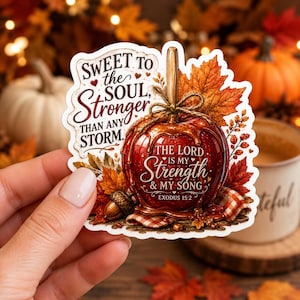 May include: A die-cut sticker featuring a glossy red candy apple with a stick, surrounded by autumn leaves and an acorn. The text reads: SWEET TO THE SOUL, STRONGER THAN ANY STORM. THE LORD IS MY STRENGTH & MY SONG. EXODUS 15:2 in decorative fonts.