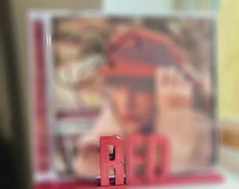 Expositor de pared para CD rojo / Soporte de pared para CD personalizado