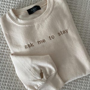 Dawson&#39;s Creek Embroidered Sweatshirt: &quot;ask me to stay&quot; with Paintbrush Detail on sleeve