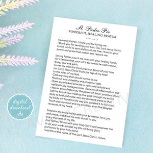May include: A white rectangular card featuring the black printed text St. Padre Pio Powerful Healing Prayer. The prayer includes lines such as Heavenly Father, I thank you for loving me, and ends with I ask this in the name of the Lord Jesus Christ. Amen.
