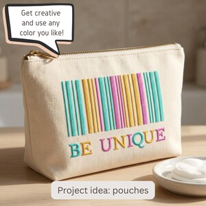 May include: A cream-colored canvas zipper pouch featuring an embroidered barcode design in teal, yellow, and pink, with the text BE UNIQUE embroidered below in matching colors. A speech bubble above reads: Get creative and use any color you like!