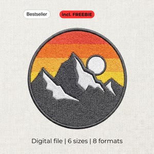 May include: A circular embroidered patch design featuring dark gray mountains with white snow-capped peaks against a sunset sky of orange, yellow, and red horizontal bands. A white circular sun is positioned behind the mountain range.
