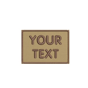 May include: A tan embroidered patch with a brown border. The patch says "YOUR TEXT" in brown embroidery.