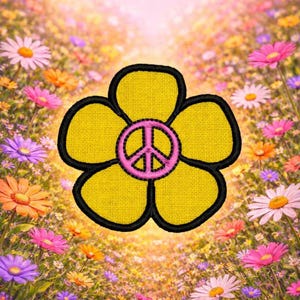 May include: A yellow flower patch with a black outline and a pink peace sign in the center. The flower is set against a background of colorful flowers in a field, creating a vibrant and cheerful design.