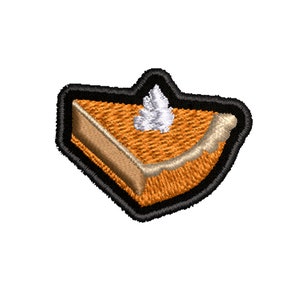 May include: A brown and orange embroidered patch of a slice of pumpkin pie with a dollop of white whipped cream on top.