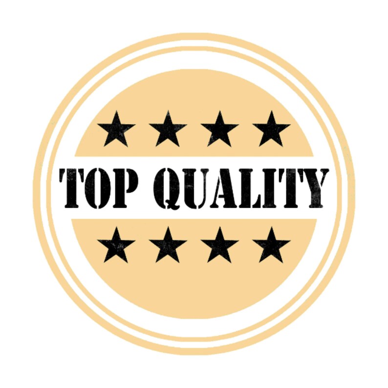 May include: A round, tan-colored sticker with the words "TOP QUALITY" in bold black letters. The sticker is encircled by two concentric rings and features six black stars, three above and three below the text.