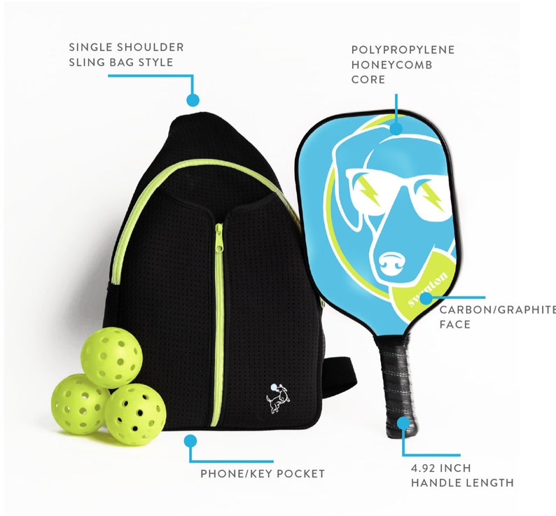 May include: A black and green single-shoulder sling bag with a zippered pocket and a small dog logo. The bag is next to a blue and green pickleball paddle with a dog graphic and the text "syuton". Three green pickleballs are in front of the bag. The paddle has a 4.92 inch handle length.