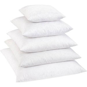 May include: A stack of five white pillow inserts of different sizes. The inserts are made of a soft, fluffy material and are perfect for adding comfort and support to your pillows.