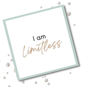 May include: A white card with a light blue border and the text "I am Limitless" written in black and gold lettering. The card is surrounded by white pearls.