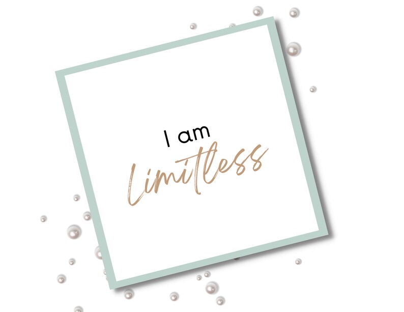 May include: A white card with a light blue border and the text "I am Limitless" written in black and gold lettering. The card is surrounded by white pearls.