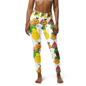 May include: White leggings with a colorful pattern of smiling cartoon fruits, including oranges, pears, watermelons, and pineapples. The leggings have a high waist and a comfortable fit, perfect for workouts or casual wear.