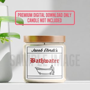 May include: A white candle jar with a gold lid and a label that reads "Jacob Elordi's Bathwater". The label features a black and white illustration of a bathtub with a tap.