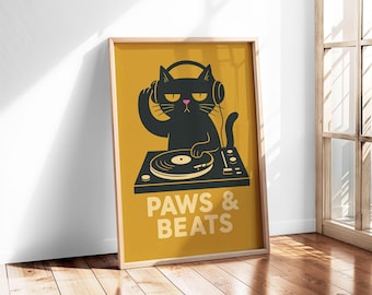 May include: A framed poster featuring a black cat DJ wearing headphones, with a turntable. The poster has a mustard yellow background with the words "PAWS & BEATS" in white. The cat has a pink nose and is silhouetted.
