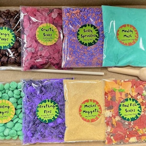 May include: A science experiment kit with colourful ingredients and tools. The set includes bags of "Pongy Poops", "Crusty Scabs", "Sickly Sprinkles", "Mouldy Mush", "Bubbling Bogies", "Frothing Flies", "Mashed Maggots", and "Foul Fish Scales".