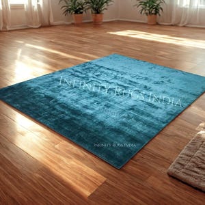 Luxurious silk Rug for livingroom and bedroom. Teal color art silk rug its soft silky and shiny rug for indoor use. 5x8 rug, 8x10 rug