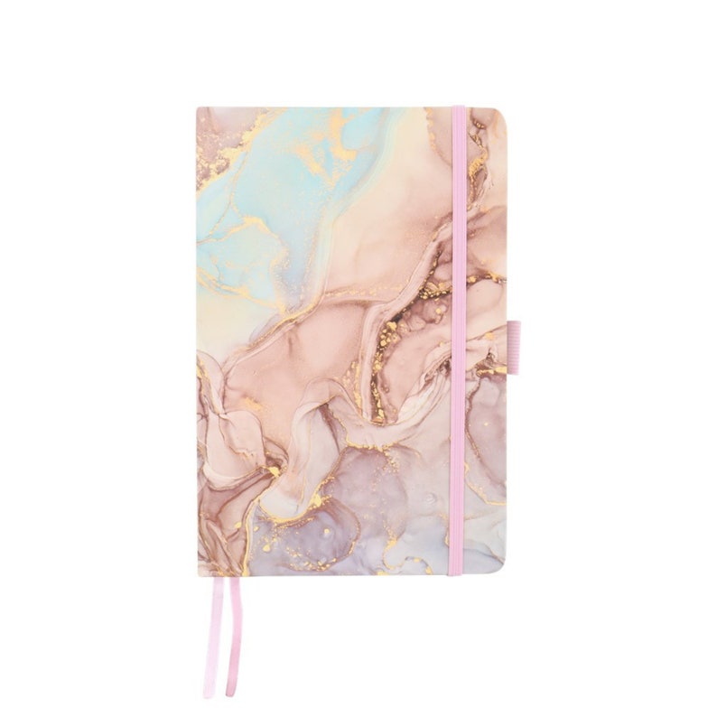 May include: A hardcover notebook with a marbled design in shades of pink, blue, and gold. The notebook features a pink elastic band closure and a matching ribbon bookmark. The cover has a flowing, abstract pattern.