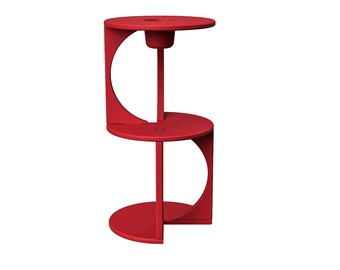 May include: A red side table with a unique design. It features three circular platforms connected by vertical supports. The top platform has a small, cylindrical holder. The table is approximately 28 inches tall.