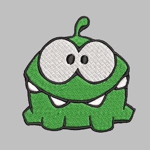 May include: Embroidered patch featuring a green, cartoon-like character with large white eyes outlined in black. The character has a wide, toothy grin and a small, curved antenna. The patch is on a gray background.
