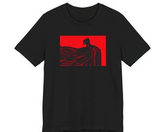 赤いTシャツを着て物思いにふける