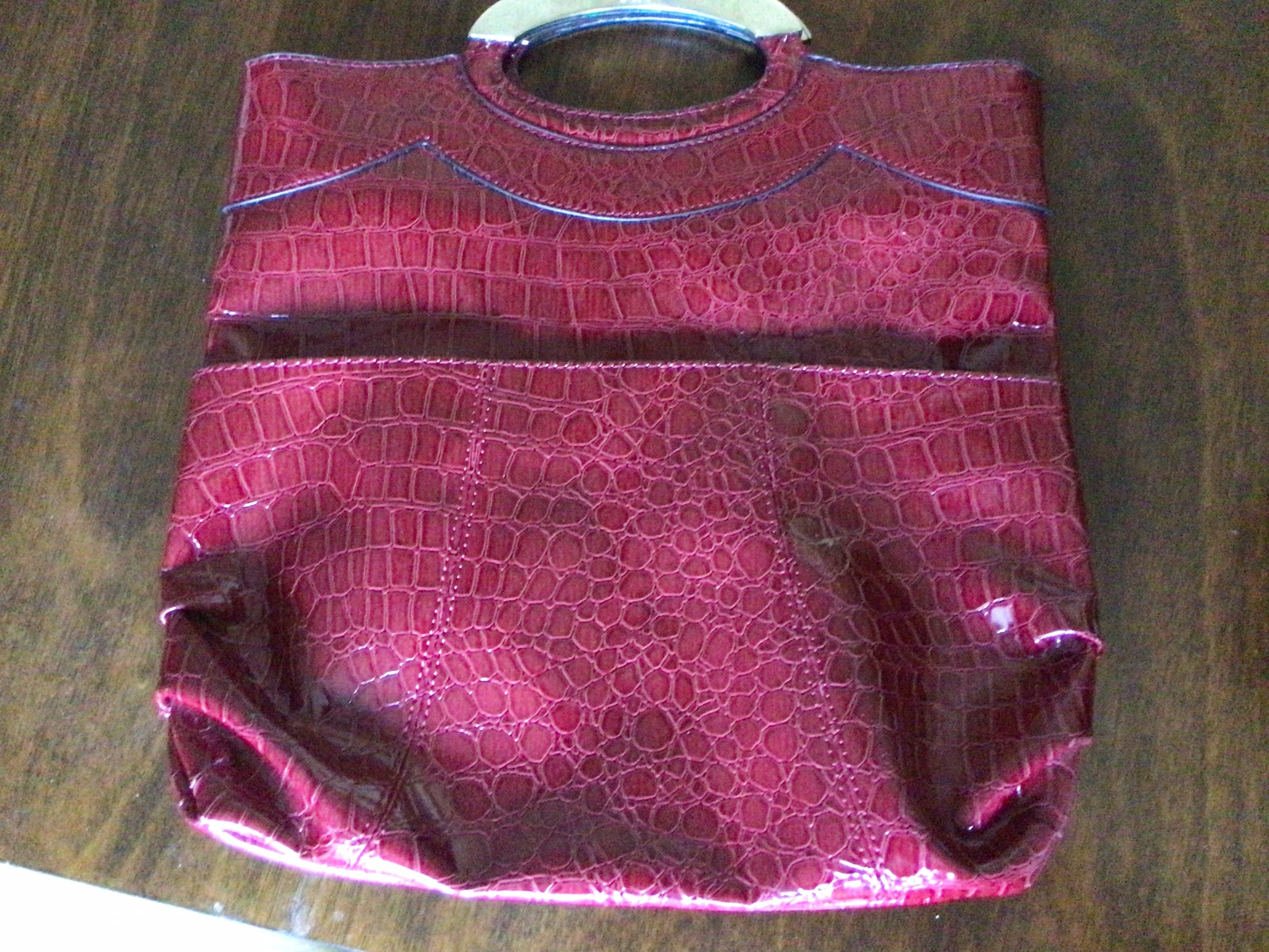 Red snakeskin Hermès bag