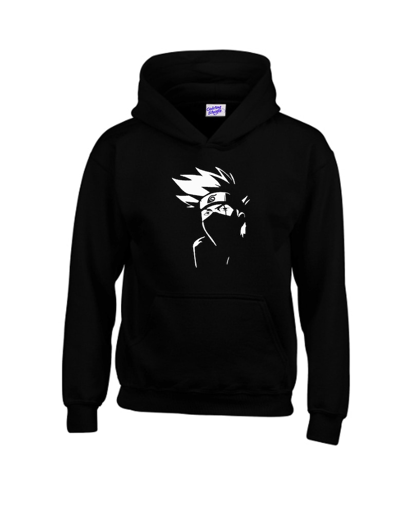May include: Black hooded sweatshirt featuring a white graphic of a character with spiky hair and a face covering. The design is a stylized silhouette, with details like the character's headband and facial features. The sweatshirt has a kangaroo pocket and a drawstring hood.