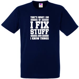 May include: Navy blue t-shirt with white text that reads "That's what I do I fix stuff and I know things".