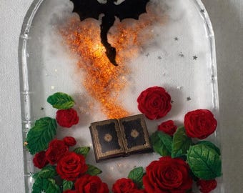 Dragon flying from book and roses resin art