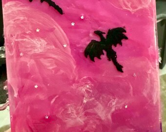 Dragon silhouettes in pink sunset