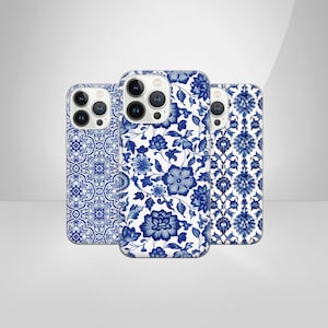 May include: Three different iPhone cases with blue and white patterns. The patterns are inspired by traditional Chinese porcelain.