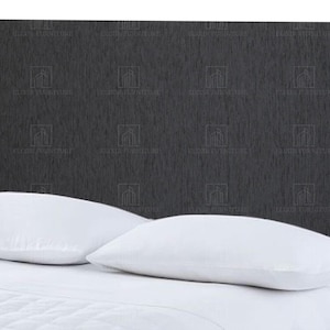 May include: A dark grey upholstered headboard with a textured pattern, complemented by white pillows and bedding. The rectangular headboard is positioned behind the pillows, offering a simple, modern bedroom design.