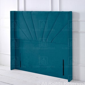 May include: Teal velvet headboard with a sunburst design. The headboard has two vertical slits on the side.
