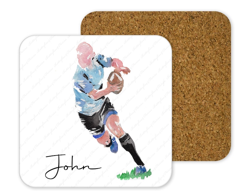 May include: A watercolor illustration of a rugby player running with the ball. The player is wearing a blue and white jersey and black shorts. The player's name, "John", is written in cursive at the bottom of the image.
