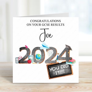 May include: A white card with black text that reads "Congratulations on your GCSE results Joe 2024 You did it!!!". The number 2024 is made up of black chalkboard-style numbers with various school supplies and objects around them.