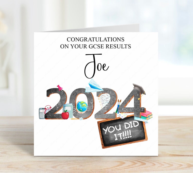 May include: A white card with black text that reads "Congratulations on your GCSE results Joe 2024 You did it!!!". The number 2024 is made up of black chalkboard-style numbers with various school supplies and objects around them.