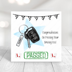 May include: A white card with a blue and white star design. The card has a black car key with a key chain that says "HARRY". The card also has a green stamp that says "PASSED" and two red "L" plates. The card reads "Congratulations on Passing Your Driving Test!"