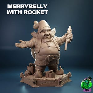 May include: A tan-colored figurine of a jolly elf holding a rocket, with the text "MERRYBELLY WITH ROCKET" above. The elf is wearing a hat, jacket, and boots, and stands on a platform with gift boxes.