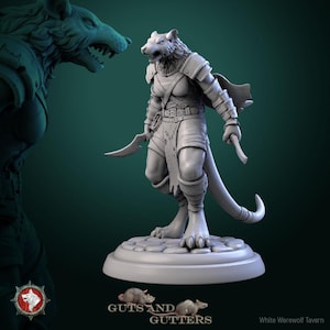 May include: A grey 3D-printed figurine of a humanoid werewolf warrior, holding two curved blades. The figure is posed on a circular base, wearing armour and a cape. The image includes the "Guts and Gutters" logo and "White Werewolf Tavern" text.