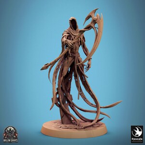 May include: A detailed miniature figurine of a skeletal figure in a hooded robe, holding a large scythe. The figure is made of a brown plastic material and is posed in a dramatic stance. The figurine is set on a circular base.