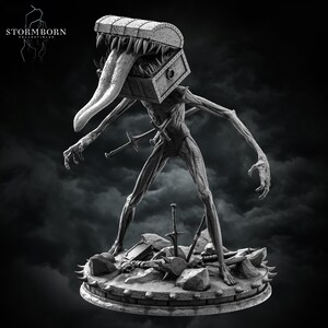 May include: A grayscale sculpture of a creature with a treasure chest head and a long tongue. The creature has thin limbs and is standing on a stone base with swords and other objects. The Stormborn Collectibles logo is in the upper left corner.