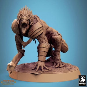 May include: A detailed, tan-colored figurine of a reptilian humanoid creature in a crouching pose. The figure has armor, a headdress, and an open mouth. The base has the text "TOTEM OF THE SCALEDWINGS" and a logo.