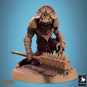 May include: A detailed figurine of a reptilian humanoid creature, kneeling with a spiked weapon. The figure is tan and brown, with armor-like details and a horned head. The base has the text "TOTEM OF THE SCALEWINGS".