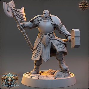 May include: A grey miniature warrior figure in full armour, wielding a large axe and a hammer. The figure stands on a circular base. The warrior has a serious expression. The base has the text "Protectors of the Cleansing Fire". The Daybreak Miniatures logo is visible.