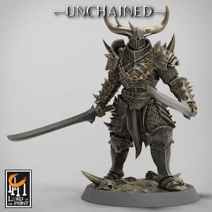 May include: A detailed bronze-colored figurine of a warrior in spiked armor, holding two swords. The figure has large horns and is standing on a textured base. The word "-UNCHAINED-" is above the figure.