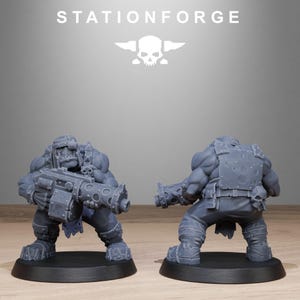 May include: Two gray miniature figures of Orcs, one holding a large gun, the other with a clenched fist. The figures are on black bases. The word "STATIONFORGE" is above the figures, along with a skull and crossbones logo.