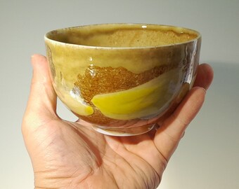 Tea bowl made of fine porcelain of colored France. decoration in yellow spots on a natural background. Large morning bowl
