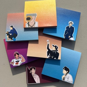 May include: A set of colorful sticky notes with various illustrations, including a person with a sunflower, a person with a dog, a person with a flower, a person with a hat, and a person with a hat and a flower. The notes are perfect for adding a touch of personality to your planner, journal, or desk.